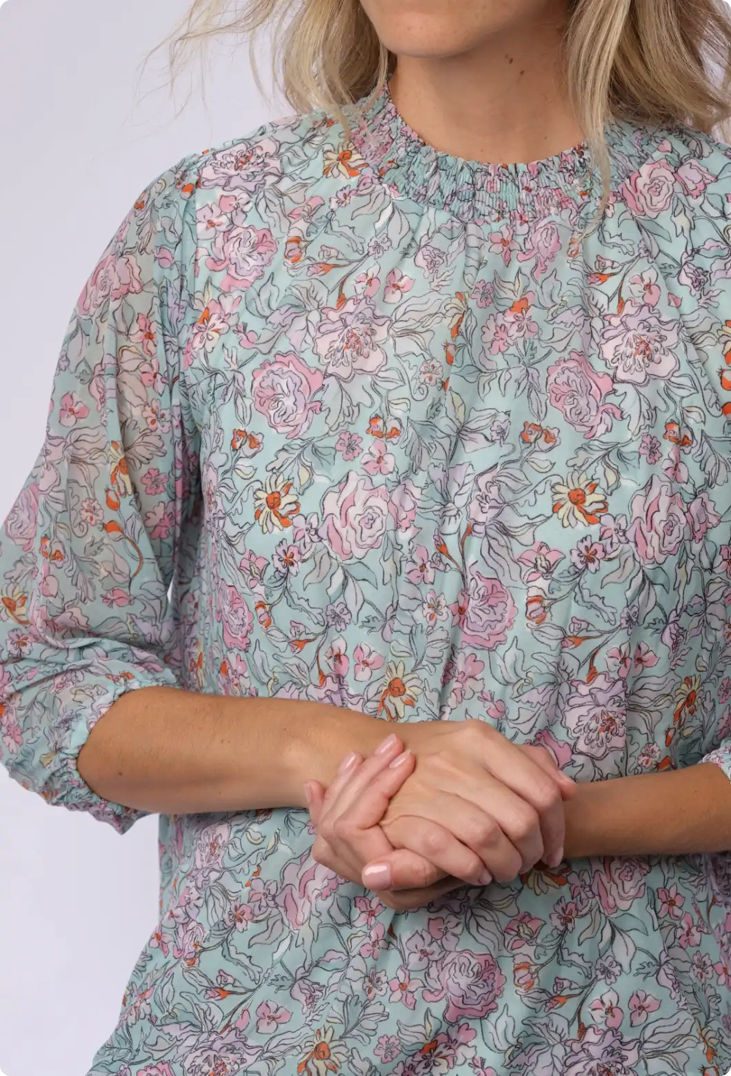 Light blue blouse with all-over rose and floral print surface design
