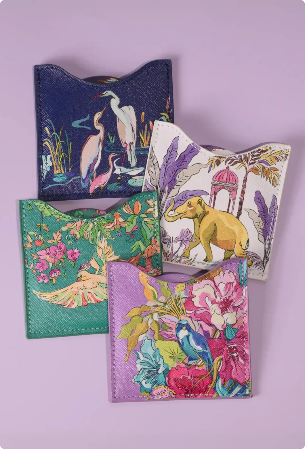 Four textured card holders with wetland, tropical elephant, parrot, and songbird designs