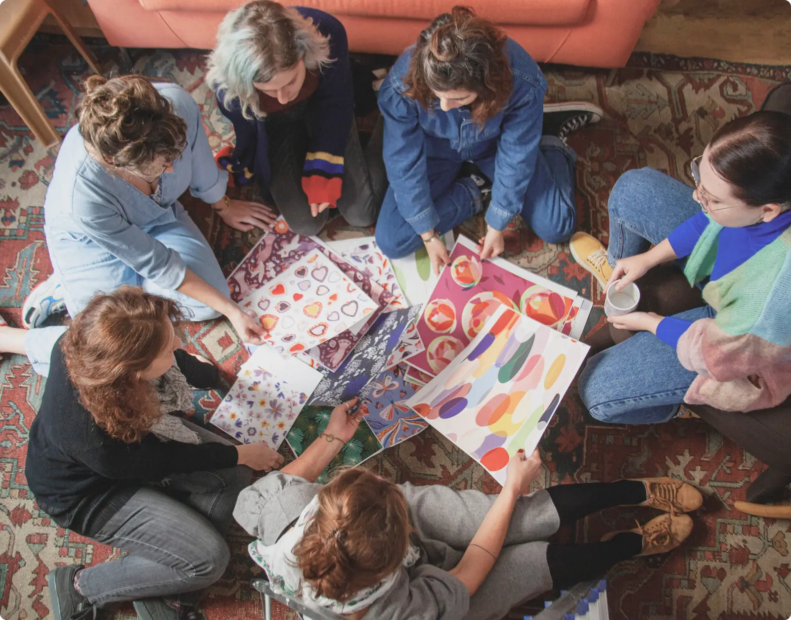 Turnowsky team gathered around colorful design work